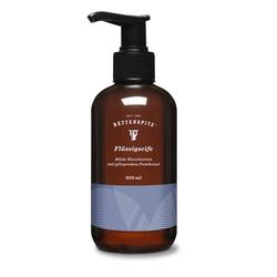 Braune Seifenflasche mit schwarzem Pumpspender und blauem Etikett.