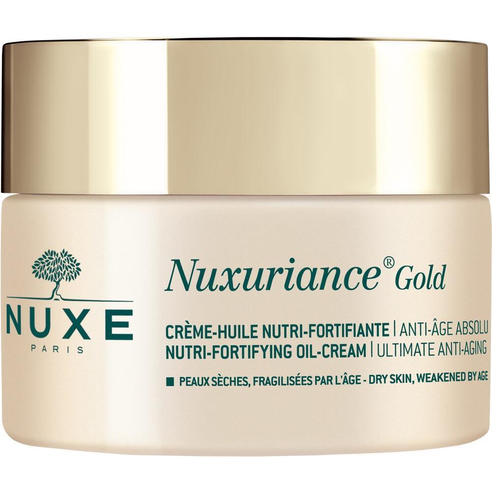Eine runde Creme-Verpackung mit der Aufschrift "Nuxuriance Gold".